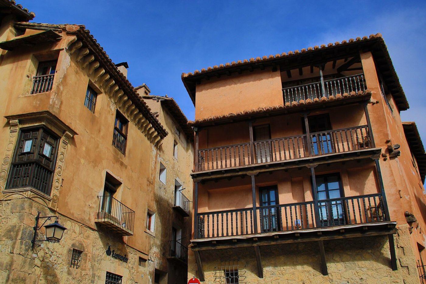 Houses with wooden balconies on a square in Albarracín