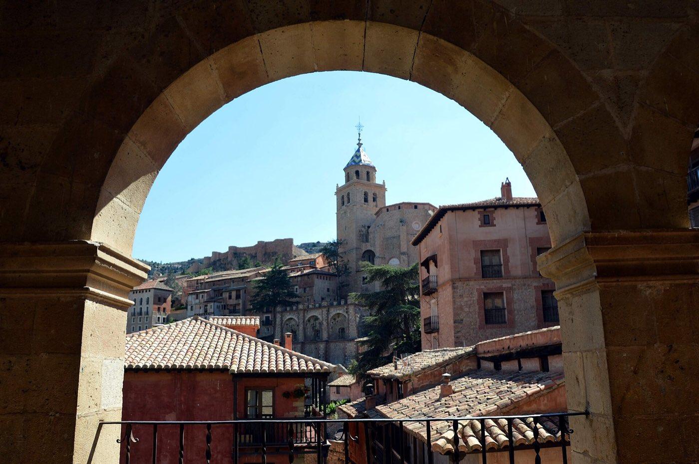 Tower of Albarracín cathedral seen from the town hall arcades