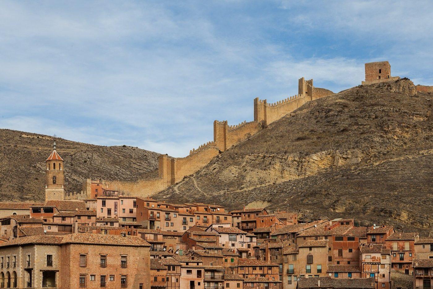 Walls of Albarracín climbing the hillside above the rooftops